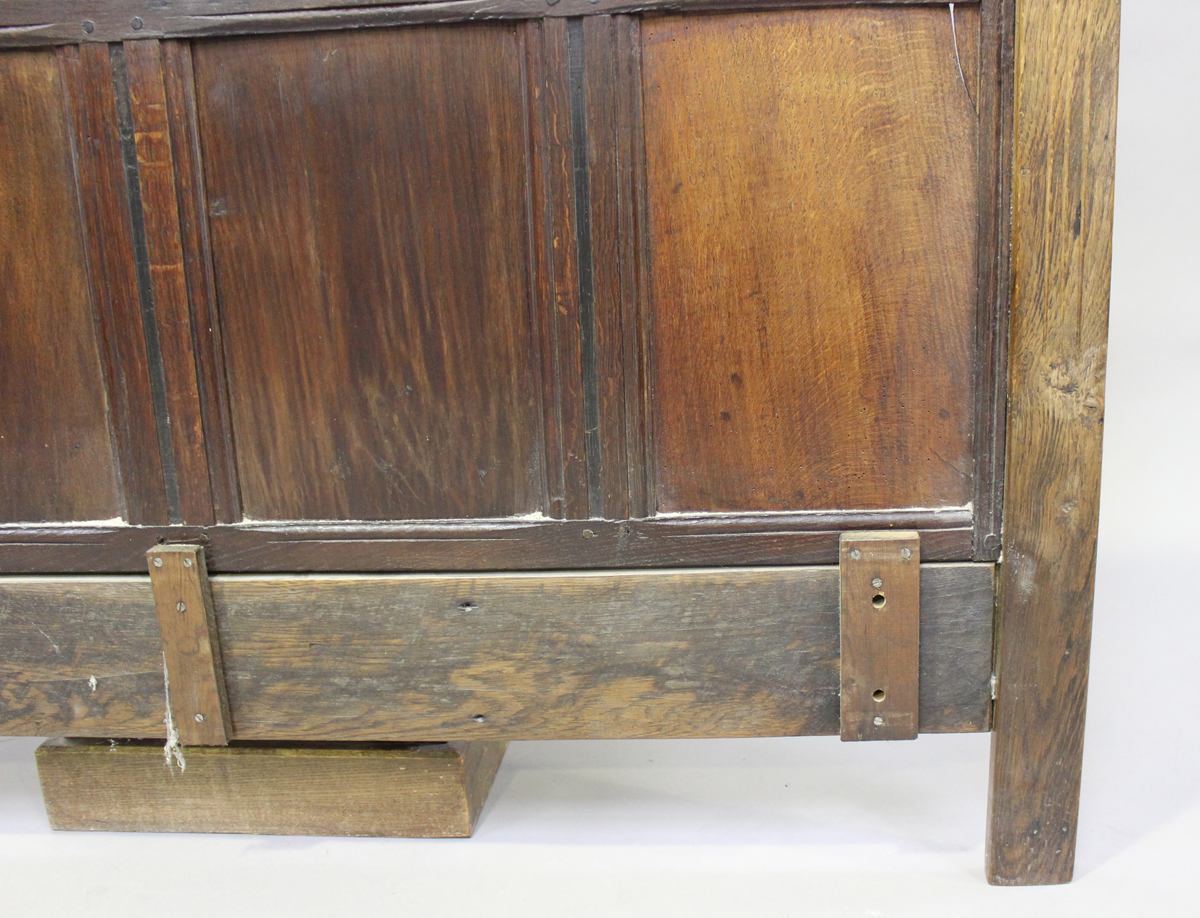 A 17th century and later oak panelled double headboard, height 130cm, width 139cm.Buyer’s Premium - Image 5 of 7