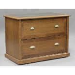 A modern oak filing chest, the top inset with gilt-tooled green leather, height 74cm, width 101cm,