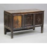 An 18th century oak panelled mule chest, the hinged lid above a central sliding panel, height