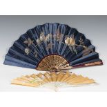 A late 19th century mother-of-pearl and silk folding fan, painted with a floral spray, length 28.