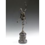 After Fulconis - a late 19th century Continental dark patinated cast bronze figure of Fortuna,