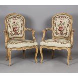 A pair of 18th century French Rococo walnut showframe fauteuil armchairs, probably by Jean-