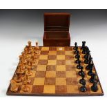 An early 20th century ebony and boxwood Staunton chess set, possibly by Jaques, the rooks and