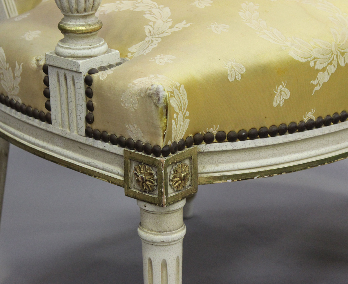 A pair of 20th century Louis XVI style white painted and gilt fauteuil armchairs, upholstered in - Image 10 of 12