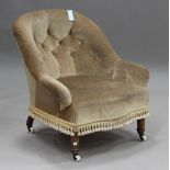 A late Victorian walnut tub back armchair, raised on china castors, height 76cm, width 73cm.Buyer’