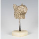 A carved granite fragmentary model of a cat's head, possibly Egyptian, raised on a plated stem and