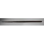 A tribal carved wooden spear head with barbed edges, length 84cm.Buyer’s Premium 29.4% (including