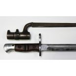 A 1917 model bayonet by Remington, blade length 42.5cm, with chromed finish, together with a late