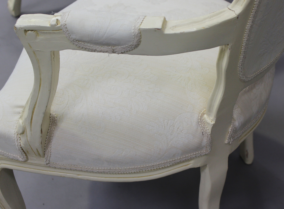 A pair of late 20th century French cream painted showframe fauteuil armchairs, height 91cm, width - Image 8 of 11