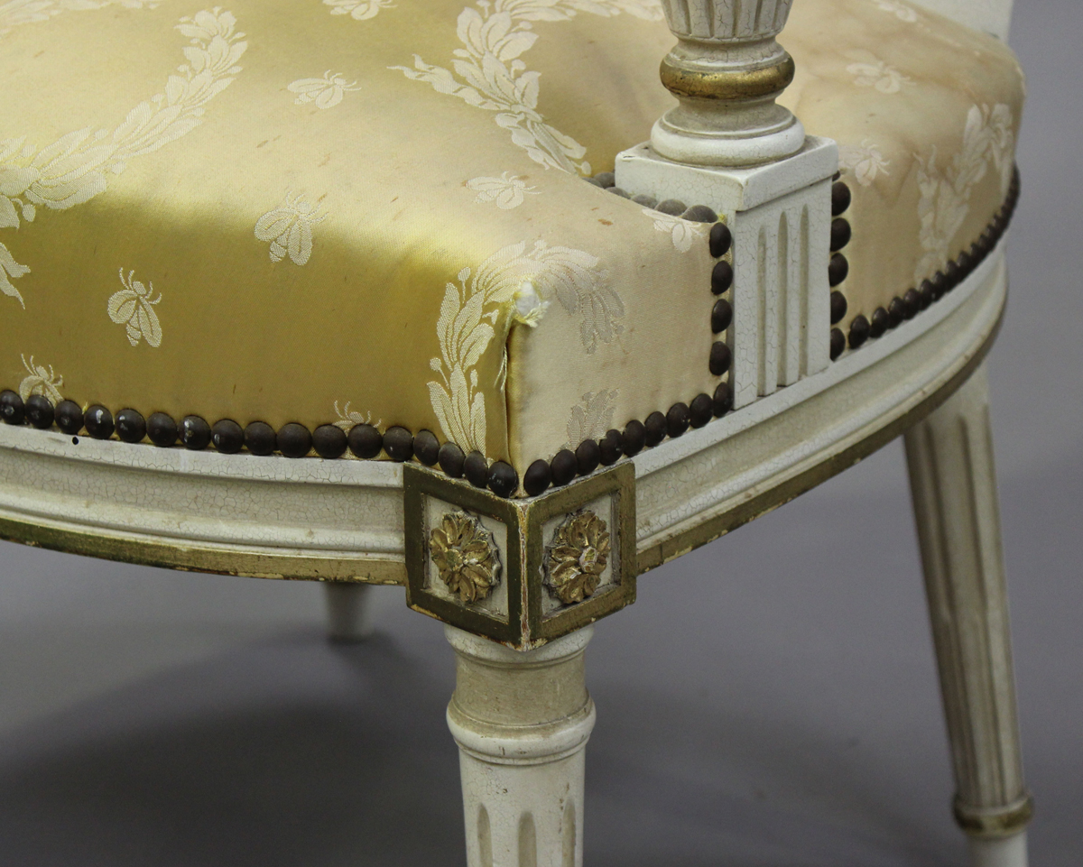 A pair of 20th century Louis XVI style white painted and gilt fauteuil armchairs, upholstered in - Image 4 of 12