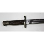 A 1907 pattern bayonet by Sanderson, blade length 43cm, with steel-mounted leather sheath.Buyer’s