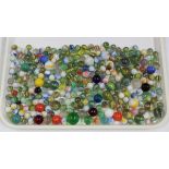 A collection of glass marbles, including some with latticino swirls, largest diameter 2.5cm.Buyer’