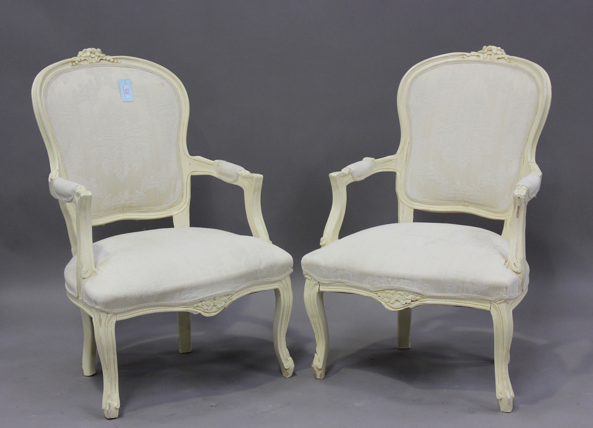 A pair of late 20th century French cream painted showframe fauteuil armchairs, height 91cm, width