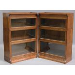 A pair of early 20th century oak Globe Wernicke style three-section glazed bookcases by Minty of