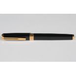 A Waterman Paris gilt metal mounted black plastic fountain pen, the nib detailed 'Waterman Ideal 18K