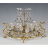 A 20th century French ormolu and cut glass liquor stand of oval form, fitted with two decanters