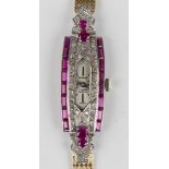 A Genève diamond and synthetic ruby set lady's dress bracelet wristwatch with unsigned jewelled