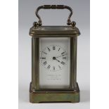 A late 19th/early 20th century French brass cased miniature carriage timepiece with eight day