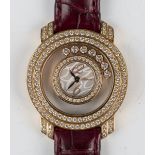 A Chopard Happy Diamonds 18ct gold and diamond set lady's wristwatch, the signed dial with gilt