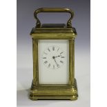 A late 19th/early 20th century brass miniature carriage timepiece with eight day movement, the
