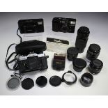 A small collection of cameras and accessories, including a Fujica ST 605N camera with 1:2.2 f=55mm