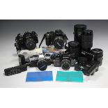 A collection of cameras, lenses and accessories, including an Olympus OM40 Program with Auto-S 1:1.8