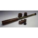 An early 20th century leather bound brass three draw telescope, detailed 'Troughton & Simms London