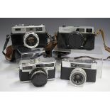 A collection of assorted cameras, including a Minolta Super 3 Circuit, a Canon Canonet, a Yashica