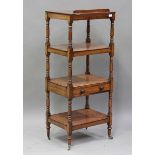 An early Victorian rosewood four-tier whatnot, fitted with a hinged reading slope and a single