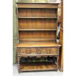 A 20th century Jacobean Revival oak dresser, the shelf back above two frieze drawers, on turned