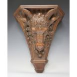 A late 19th century Neoclassical Revival carved walnut wall bracket, the tapering fluted body finely