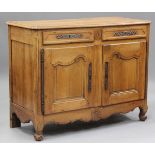 An 18th century French cherry side cabinet, the two drawers and two cupboard doors with applied
