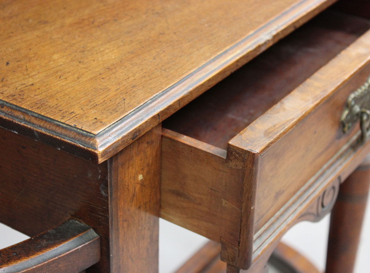 A late Victorian oak hallstand with carved foliate decoration, fitted with a drawer, on turned - Image 4 of 6