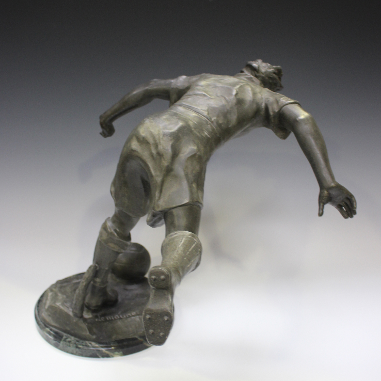 Lemoyne - a French patinated spelter figure of a footballer about to strike a ball, the base bearing - Image 3 of 6