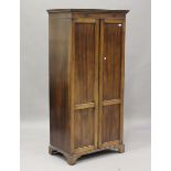 A mid-20th century mahogany two-door wardrobe, on bracket feet, height 175cm, width 83cm, depth