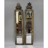 A pair of Italian gilt and simulated marble pier mirrors, probably 18th century, each narrow frame