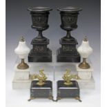 A pair of late 19th century black slate and bronze mounted ornamental urns, height 28cm, together