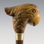 An Art Deco hardwood walking cane, the moulded resin handle cast in the form of a parrot's head,