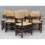 A set of eight Jacobean Revival oak dining chairs with light brown leather seats and backs,