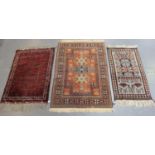 A Turkish rug, late 20th century, the chestnut field with three medallions, 180cm x 120cm,