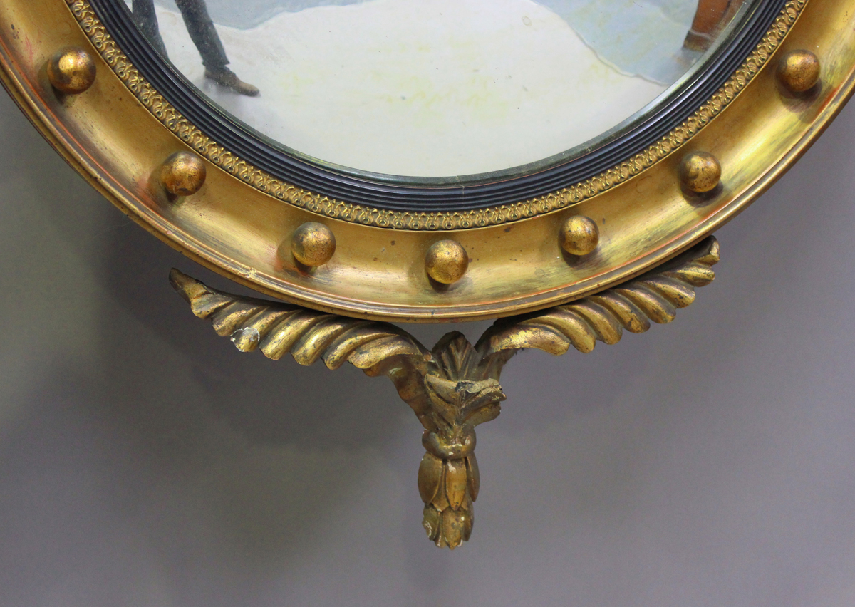 A 20th century Regency style gilt painted circular convex wall mirror with eagle surmount, height - Image 4 of 5