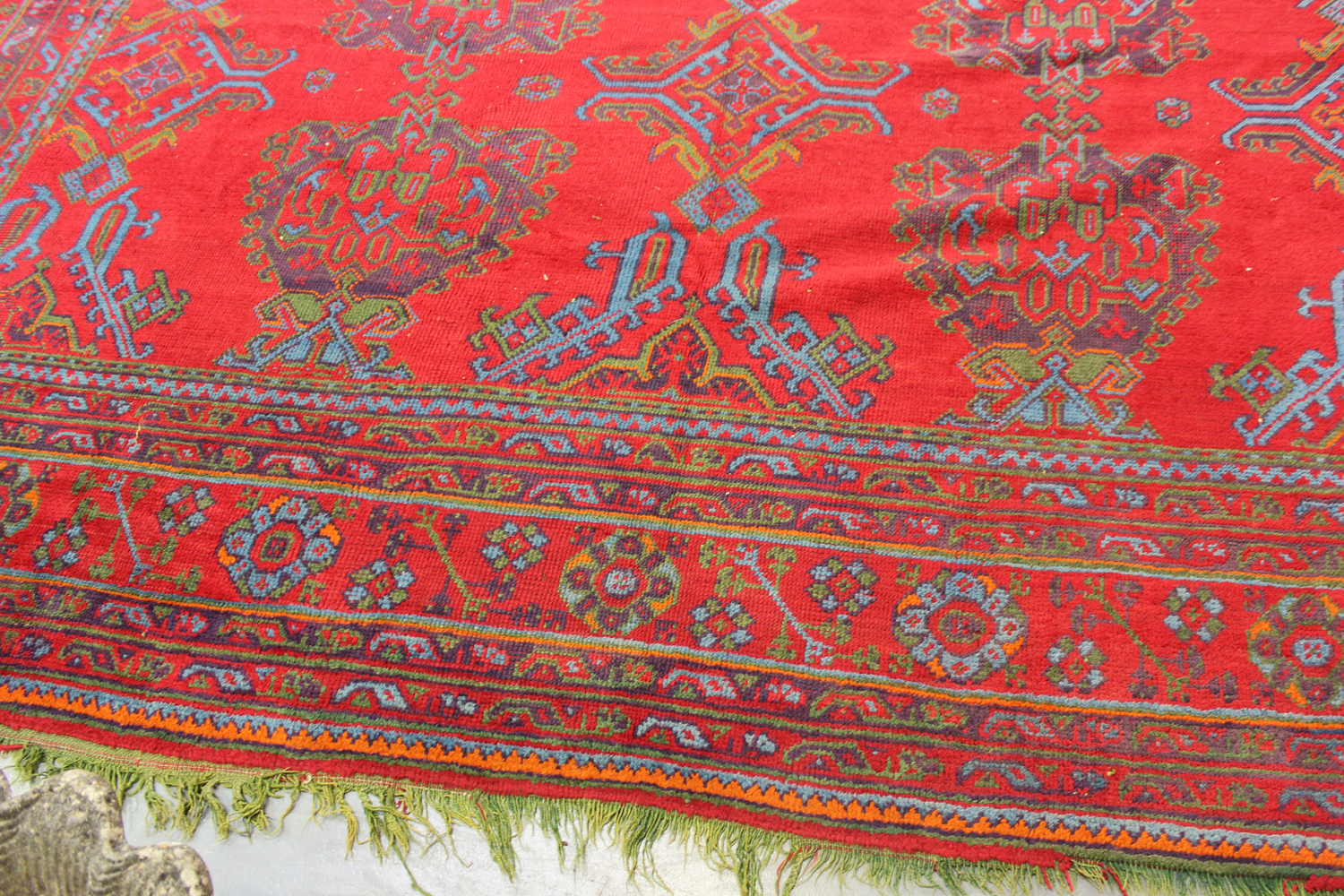 A large Turkish 'Old Turkey' carpet, early 20th century, the red field with overall palmettes and - Image 9 of 11