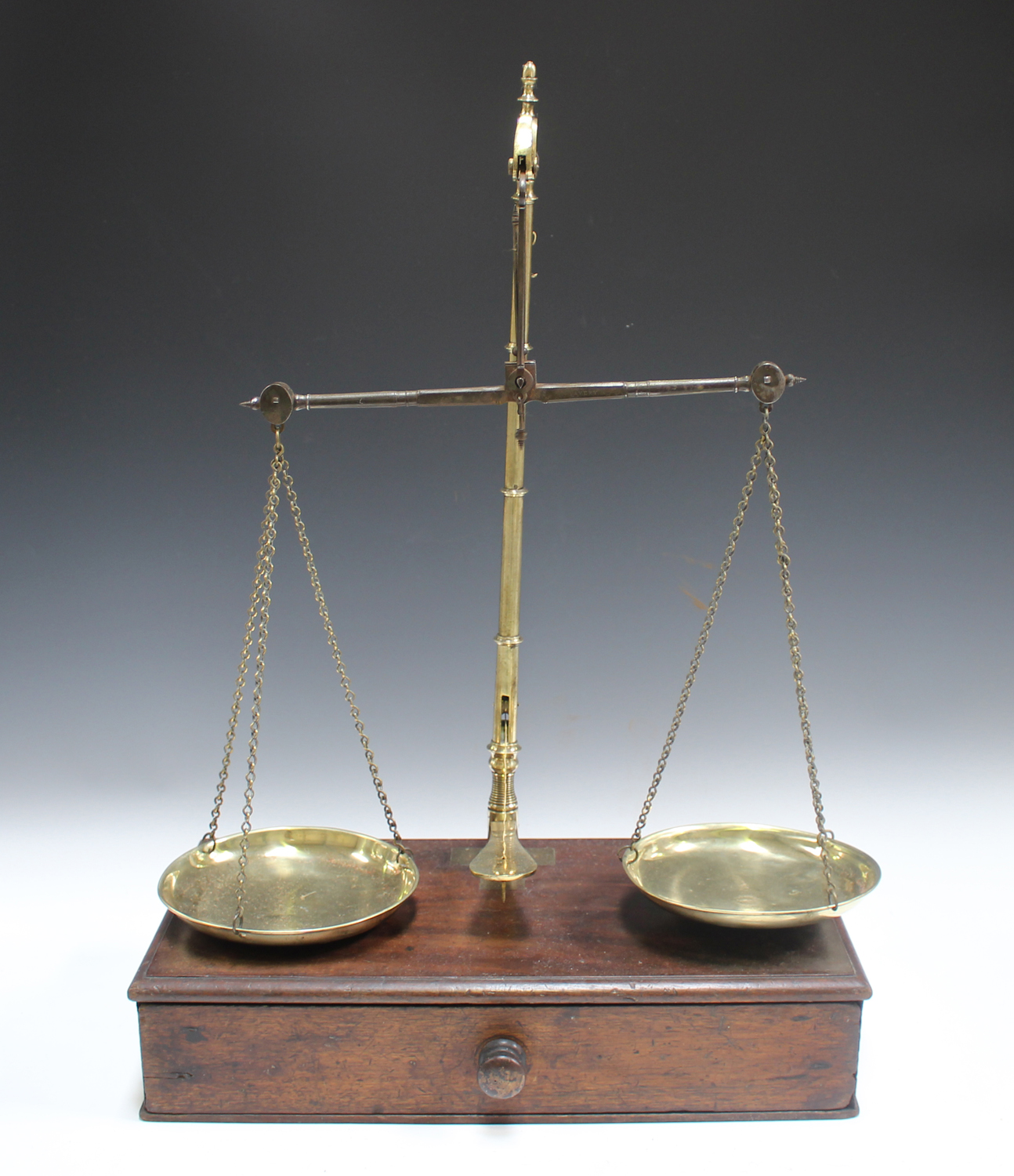 A set of late George III brass and steel balance scales, dismantling to fit into its mahogany