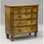 A late Victorian mahogany bowfront chest of two short and three long drawers, flanked by turned