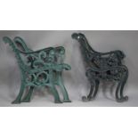 A pair of early 20th century green painted cast iron bench ends of scroll form, height 83cm, depth