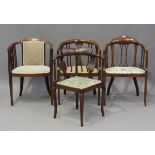 A group of four Edwardian mahogany tub back elbow chairs, all with boxwood line inlaid borders,