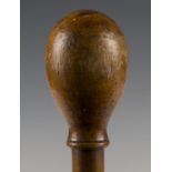 A late 19th century walking cane, the turned removable handle enclosing a pencil, the shaft