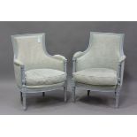 A pair of late 18th century French Louis XVI later painted showframe fauteuil armchairs, upholstered
