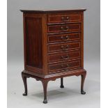 An Edwardian mahogany and satinwood crossbanded music chest, fitted with six drop-front drawers,