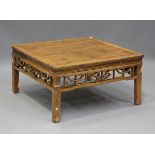 A late 19th century Chinese softwood low table with a carved and pierced frieze, height 50cm,